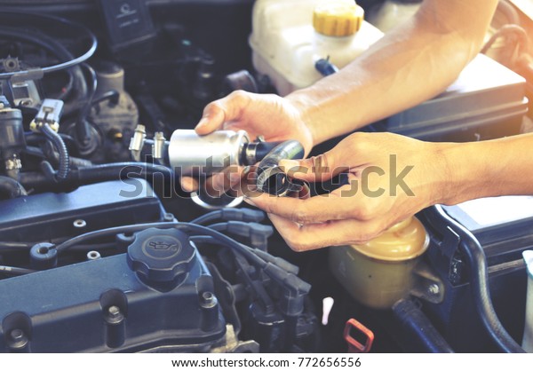 Mechanic man fix a super car engine , car\
service , car maintenance concept, repairing\
car