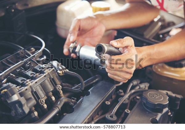 Mechanic man\
fixing car. Transportation\
concept