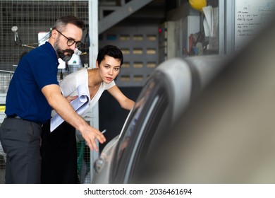 Mechanic man and woman customer check the car condition before delivery. automobile repair maintenance station garage. - Powered by Shutterstock