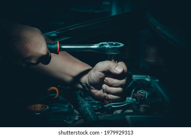 Mechanic man,Auto mechanics work on engines in auto repair garages, car repair services. The concept of repair technicians in standard service centers. - Powered by Shutterstock