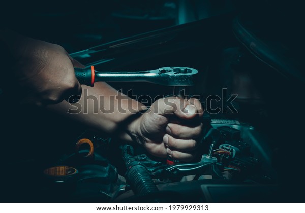 Mechanic man,Auto mechanics work on\
engines in auto repair garages, car repair services. The concept of\
repair technicians in standard service\
centers.