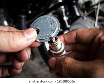 Mechanic Is Measuring Spark Plug Gap