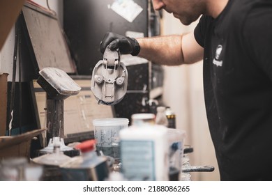 A Mechanic Mixing Paint In An Auto Body Shop.Repair And Restore Vehicles.