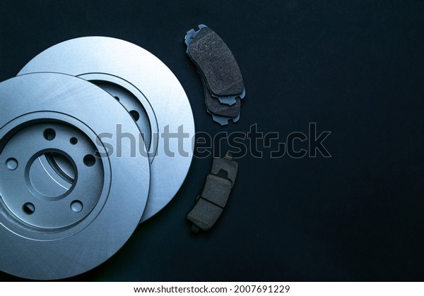 Mechanic part. New metal car part. Auto
motor mechanic spare or automotive piece isolated on black
background. Automobile engine service with space for
text