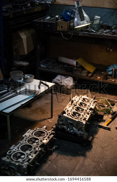 Mechanic Prepare and Drilling\
Core Piston or Plunger for Fixing Valve Head Engine in Garage\
Workshop.