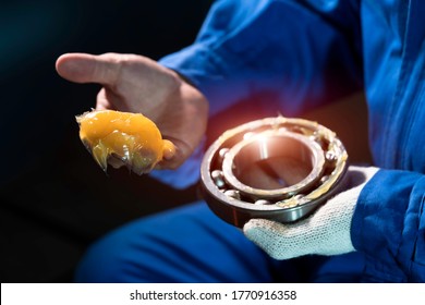 Mechanic is putting yellow grease in the into bearing, engineering and industrial concept - Shutterstock ID 1770916358