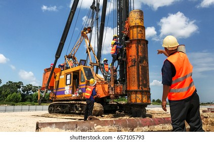 Mechanic Repair Heavy Machine In Construction Site