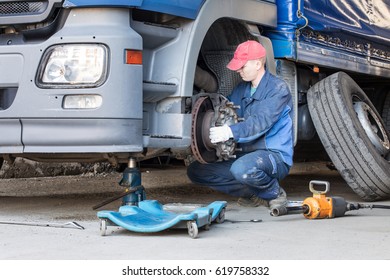 Mechanic Repair Truck Is On The Jack