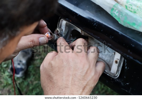 Mechanic, repairing car
and spare parts.