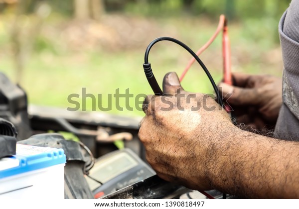 Mechanic, repairing car
and spare parts.