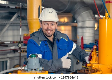 The mechanic - the repairman , operator production gas, Oil, gas industry. gas conditioning equipment and valve armature 