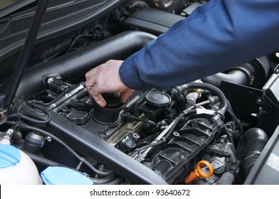 mechanic repairs a car in a garage - Shutterstock ID 93640672