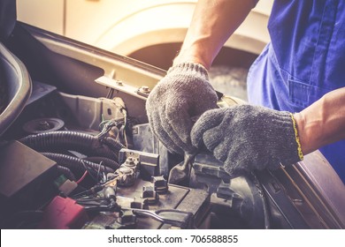 Mechanic Repairs Car In A Car Repair Station