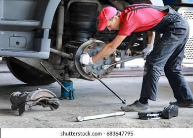 A Mechanic Repairs A Truck. Replace Brake Disc And Pads