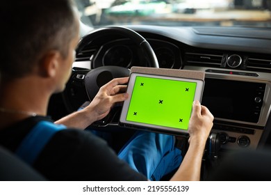 Mechanic Running Diagnostics Software On Tablet Computer With Green Screen Mockup Chromakey. Unrecognizable Vehicle Service Manager Worker Check And Maintenance To Repair The Engine Car In Workshop.