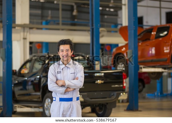 Mechanic smile at certified service garage. After\
Sale Service Chevrolet-Lao at Vientiane Capital, Laos. photo were\
taken on November 9\
2016.