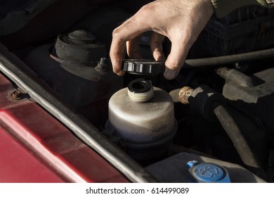 Mechanic Tightened The Valve Steering Fluid Reservoir.
Car Mechanic Lists Steering Fluid. Steering Fluid Change.