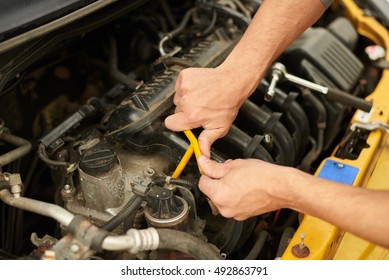 Mechanic Use Wrench For Change Spark Plugs.