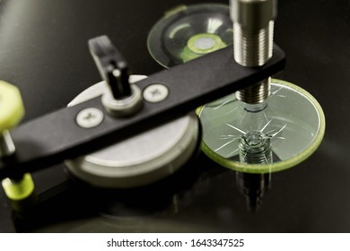 A Mechanic Uses Repair Equipment To Repair A Damaged Windshield. It Repairs Glass Chips With An Injector Under Pressure And Uses A Special Polymer.