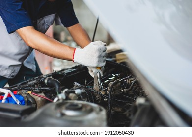 Mechanic Uses A Wrench To Fix The Car Engine.