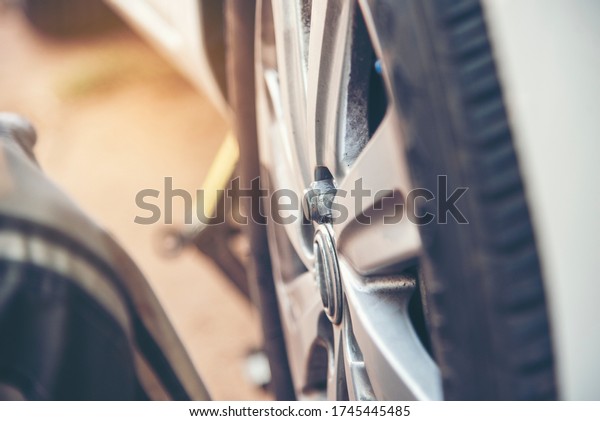 Mechanic wheel car object service repair garage\
autocar vehicles service mechanical man engineering. Automobile\
mechanical close up car wheel repairs. Mechanic technician workshop\
center