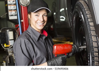 A Mechanic Woman Working On Car In His Shop