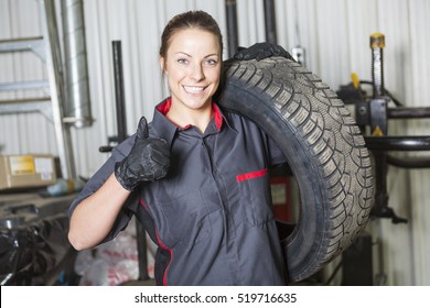 A Mechanic Woman Working On Car In His Shop