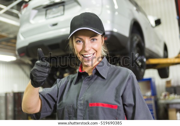 A Mechanic
woman working on car in his
shop