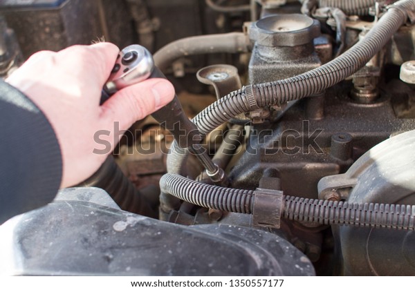 Mechanic at work. Car\
repair.