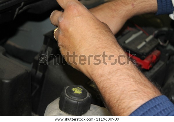 mechanic at work with motor\
car