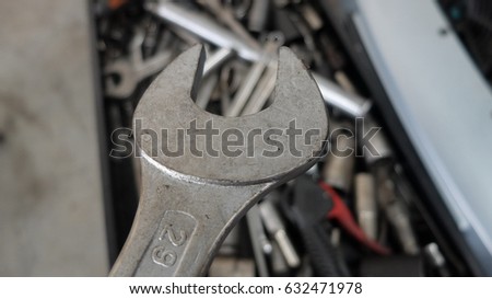 Mechanic at work with tools.