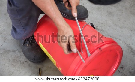 Mechanic at work with tools.