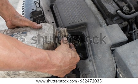 Mechanic at work with tools.