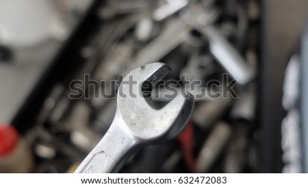 Mechanic at work with tools.
