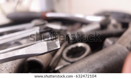 Mechanic at work with tools.