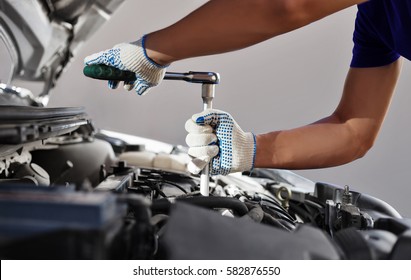 Mechanic Working In Auto Repair Garage. Car Maintenance