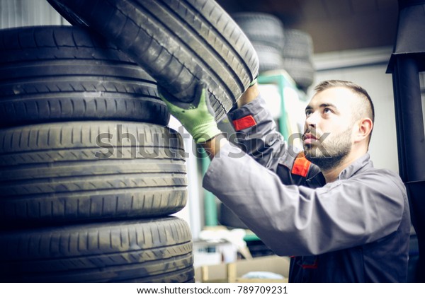 Mechanic working in auto\
repair shop.