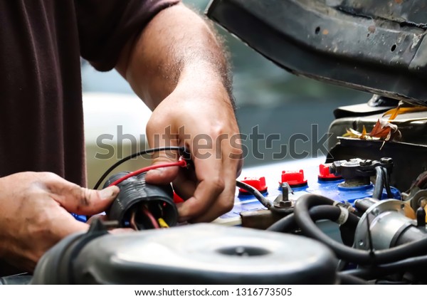 Mechanic
working with car spare parts and off road
car.