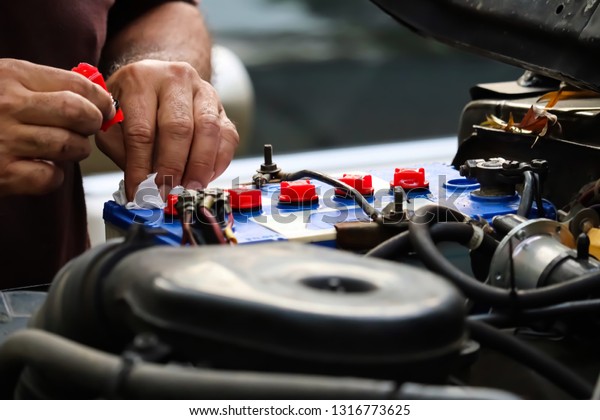 Mechanic\
working with car spare parts and off road\
car.