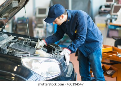 Mechanic Working In His Workshop