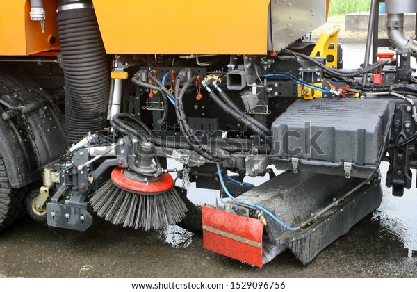 mechanical\
cleaning of the road surface with a\
car