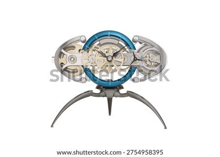 A mechanical clock with a blue ring and silver frame, featuring exposed gears and a tripod stand. The intricate showcases the internal clockwork with detailed silver gears and a minimalist...