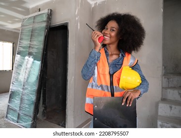 Mechanical Engineer African American Woman Use Walkie Talkie On Construction Home Building Site