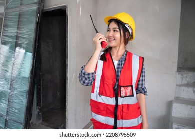 Mechanical Engineer Asia Woman Use Walkie Talkie On Construction Home Building Site