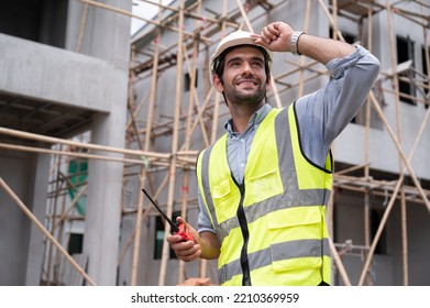 Mechanical Engineer Caucasian Working With Walkie Talkie On Construction Home Building Site