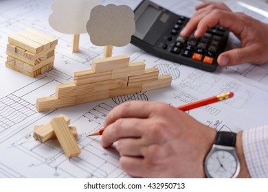 Mechanical Engineer At Work. Technical Drawings. Paper With Technical Drawings And Diagrams.