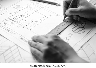 Mechanical engineer at work. Technical drawings. Paper with technical drawings and diagrams. - Shutterstock ID 463897790