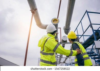 Mechanical Engineer Working Install Chilled Water Pipe System. Engineer Consult Discussion With Team Work For Install Pipe.