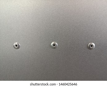 Mechanical Engineering Pattern Of Steel Panel With Three Rivets. Abstract Industrial Template With Matt Metal Powder Coating Texture Background And Extensive Copy Space. MInimalism Photo Design.