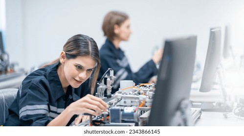 Mechanical engineering team working in robotic technology lap for research and develop for manufacturing automation and robotics. 
